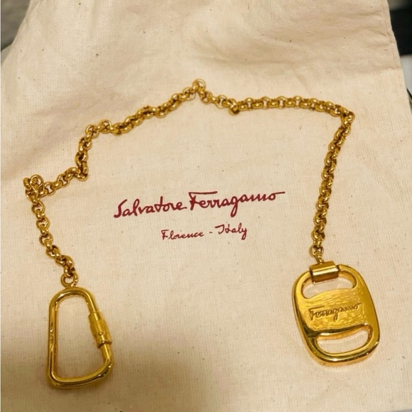 SALVATORE FERRAGAMO GOLD TONE KEYCHAIN/BAG CHARM. DUST BAG NOT INCLUDED. L 14”
